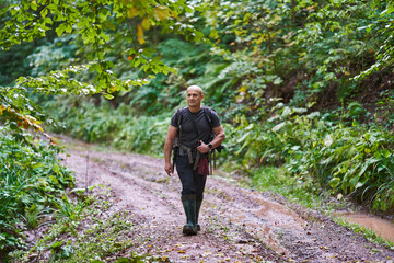 Fototapeta premium Nature photographer hiking in the forest