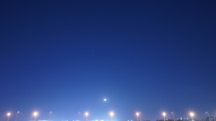 The moon night view with the bright moon in the dark sky at night