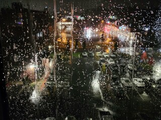 Rainy Nights with Lights - various views of raindrops clinging to the window. Distortion, blur, focus on foreground. All to enhance and accentuate the beauty of rain and its ultimate creation of art.