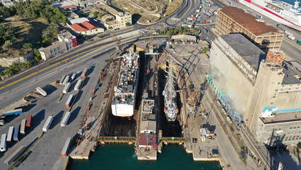 Aerial drone top photo of shipyard repairing small passenger vessels restoring sea and rust damage