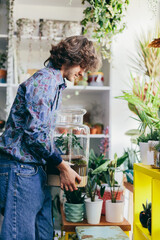 Young man working in florist shop.