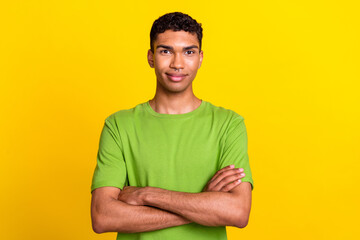 Photo of young handsome attractive positive guy confident folded hands professional programmer expert look you isolated on yellow color background