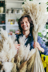 Young man working in florist shop.