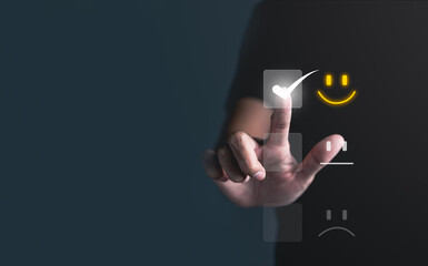 Businessman pressing smiley face emoticon on virtual touch screen. best rating positive, Customer service evaluation concept. quality review, feedback survey, marketing performance, satisfaction user.