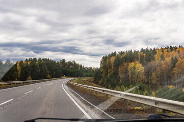 Autumn landscape. On the freeway. Travel by car.