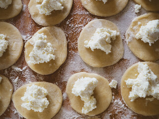 Fresh ravioli handmade cooking on wooden desk. And ricotta ravioli.