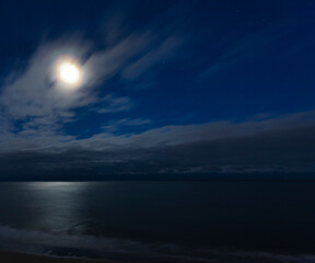 Fototapeta na wymiar Moon on a cloudy night over Myrtle Beach