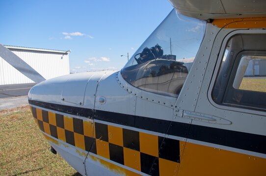 Front left section of high wing airplane - Powered by Adobe