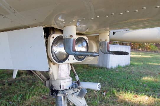 Underside of abandoned airplane. This is landing lights and pitot tubes on front landing gear