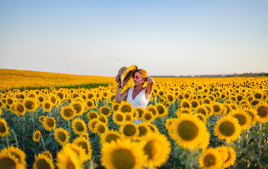 elegant woman walking in the field of sunflowers in jerez de la frontera, andalusia spain