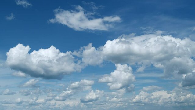 Cloud cumulus nature background. Blue sky with clouds and sun. Nature background of airy cloudscape. Timelapse.