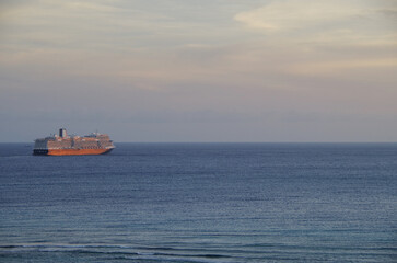 Modern HAL cruiseship or cruise ship liner Koningsdam sail away departure from port during...