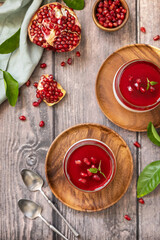 Winter delicious italian dessert panna cotta with pomegranate jelly and mint, homemade cuisine on a...