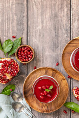 Winter delicious italian dessert panna cotta with pomegranate jelly and mint, homemade cuisine on a...