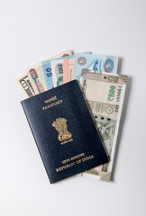 Currency notes of many countries inserted in the Indian legal passport booklet. Idea for Indian citizens traveling abroad or earning foreign exchange.