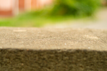 Backdrop with old stone parapet in soft focus. Template for adding an object.