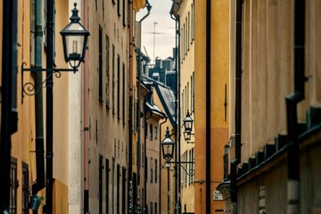 Scenic shot of the narrow Priest's Street with lamps in Stockholm, Sweden