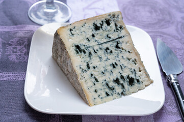 Piece of Bleu de Laqueuille semi-hard AOP French blue cheese made from raw cow milk