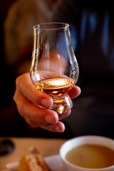 Tasting of single malt scotch whisky in whiskey bar in Edinburgh, UK
