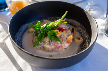 Tartare of seabass with mango, passion fruit and coconut milk