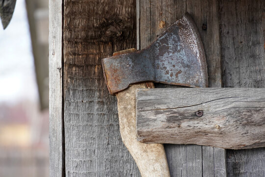 Old ax with wooden handle. High quality photo