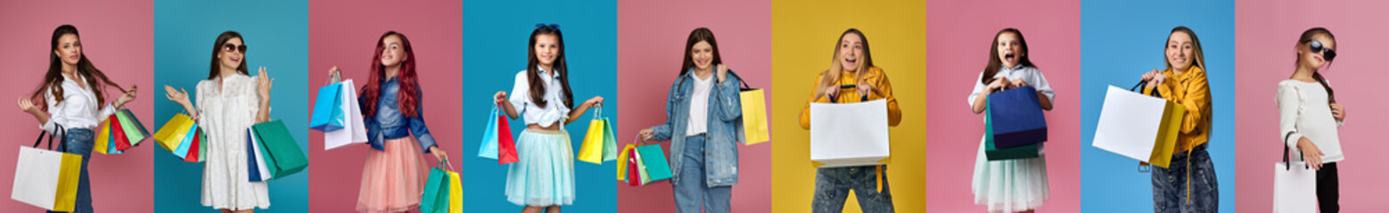 excited smiling women and girls with shopping bags