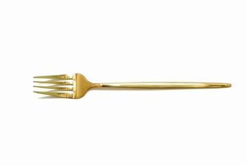 gold cutlery on a white background