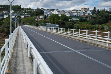 New Bridge over the Belesar Reservoir on the Miño River and the town of Portomarín, Lugo, Galicia, Spain. French Way of Saint James.