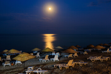 Night view of the sea beach resort tourist town. Romantic background in travel