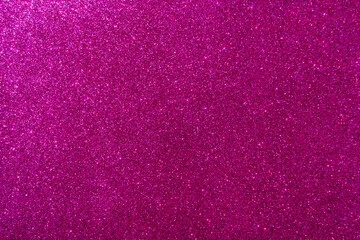 Background with sparkles. Backdrop with glitter. Shiny textured surface. Dark pink