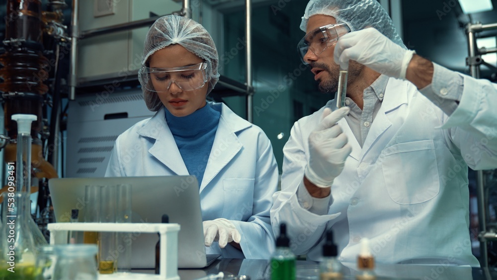 Poster two scientist in professional uniform working in laboratory for chemical and biomedical experiment