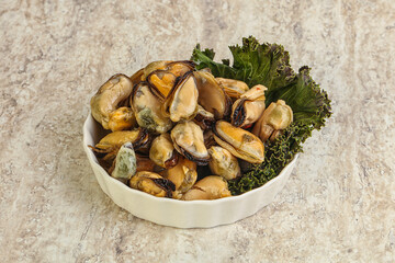 Tasty marinated mussels in the bowl