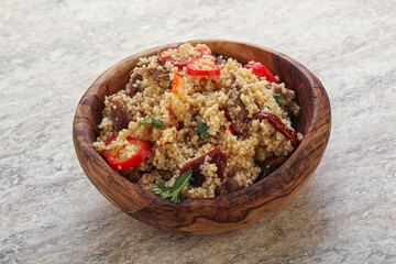 Arabic cous cous with meat and tomato
