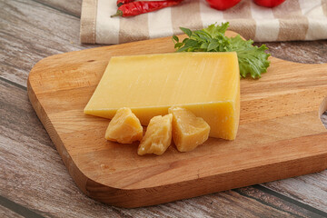 Parmesan hard cheese with small pieces