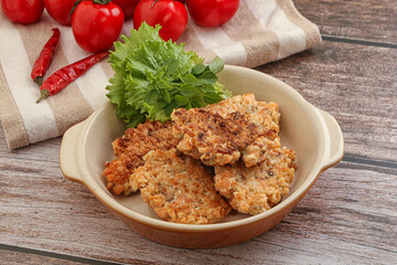 Fried salmonn cutlet in the bowl