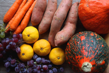 Various healthy autumnal food on wooden table. Top view.