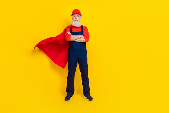 Full size photo of best retired carpenter loader plumber standing crossed arms isolated on bright color background