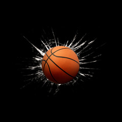 Fast basketball through broken glass on black background