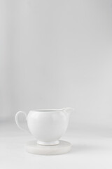 Ceramic milk jug, milk jug on a marble coaster