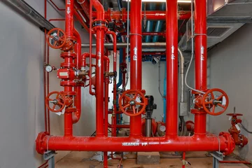 Fototapeten Feuer & Flamme Room Fire suppression system installation with a alarm check valve. Fire suppression system and fire equipment Room.  © kanpisut
