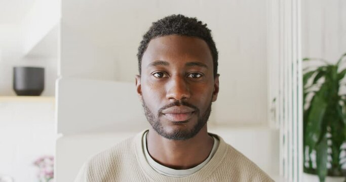 Portrait of happy african american man looking at camera and smiling