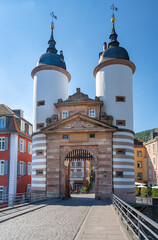 The historical old bridge gate with two towers in Heidelberg , Baden Wuerttemberg, Germany, Europe
