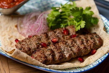 lula kebab on a plate in a restaurant