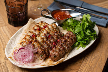 lula kebab on a plate in a restaurant