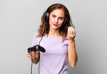 hispanic pretty woman making capice or money gesture, telling you to pay. gamer concept