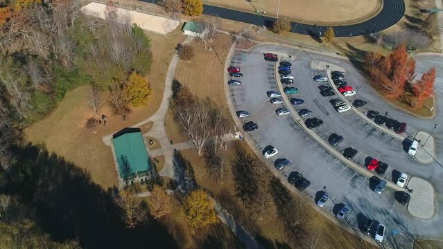 Aerial Top Down View Circling Parking Lot At Busy Park