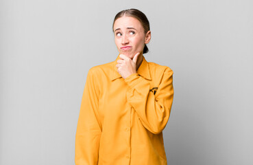 caucasian pretty woman thinking, feeling doubtful and confused. guilt concept