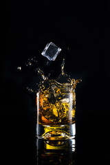 Glass of whiskey with ice