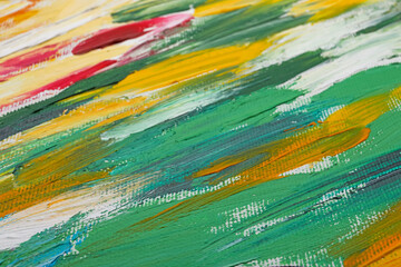 Beautiful strokes of colorful oil paints on white canvas as background, closeup