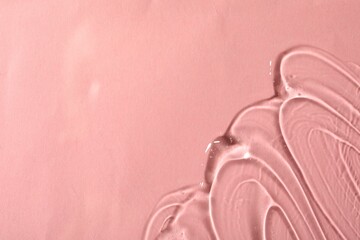 Cosmetic gel on pink background, top view. Space for text